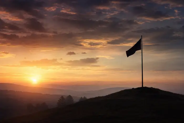 Dignified dawn light over a still landscape with a lone flag silhouette on a hill, solemn and respectful mood, no people, no text